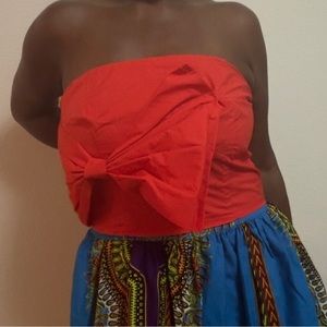 Orange tube top with large bow.